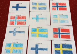 Flagi państw skandynawskich pokolorowane przez dzieci