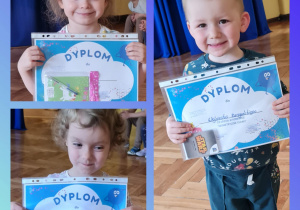 Dzieci z grupy I pozują z dyplomami
