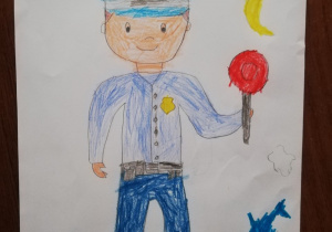 Rysunek przedstawiający policjanta z lizakiem